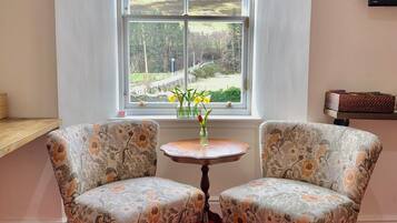 Premium bedding, desk, laptop workspace, blackout drapes