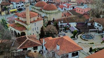 A town with historic architecture, including a prominent tower and domed buildings.