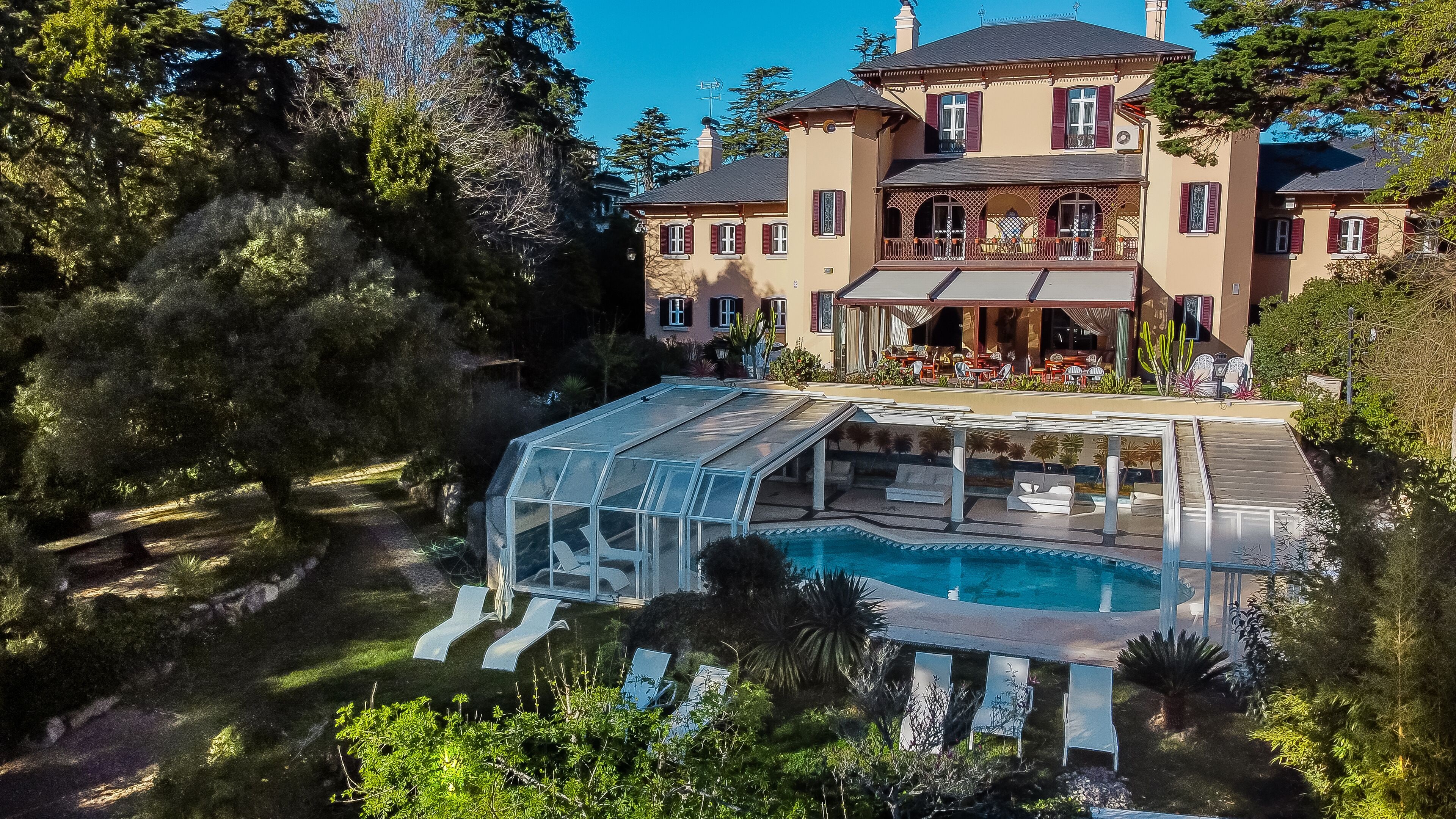 Indoor pool, outdoor pool, open 8:00 AM to 9:00 AM, pool umbrellas