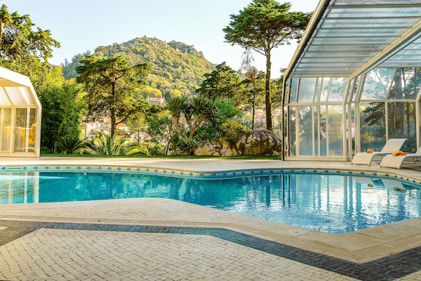 Indoor pool, outdoor pool, open 8:00 AM to 9:00 AM, pool umbrellas