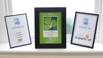 Three framed certificates on a window sill.