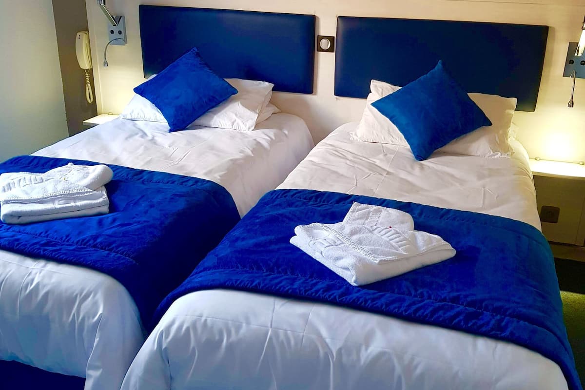 Chambre Classique Double ou avec lits jumeaux | Draps fournis