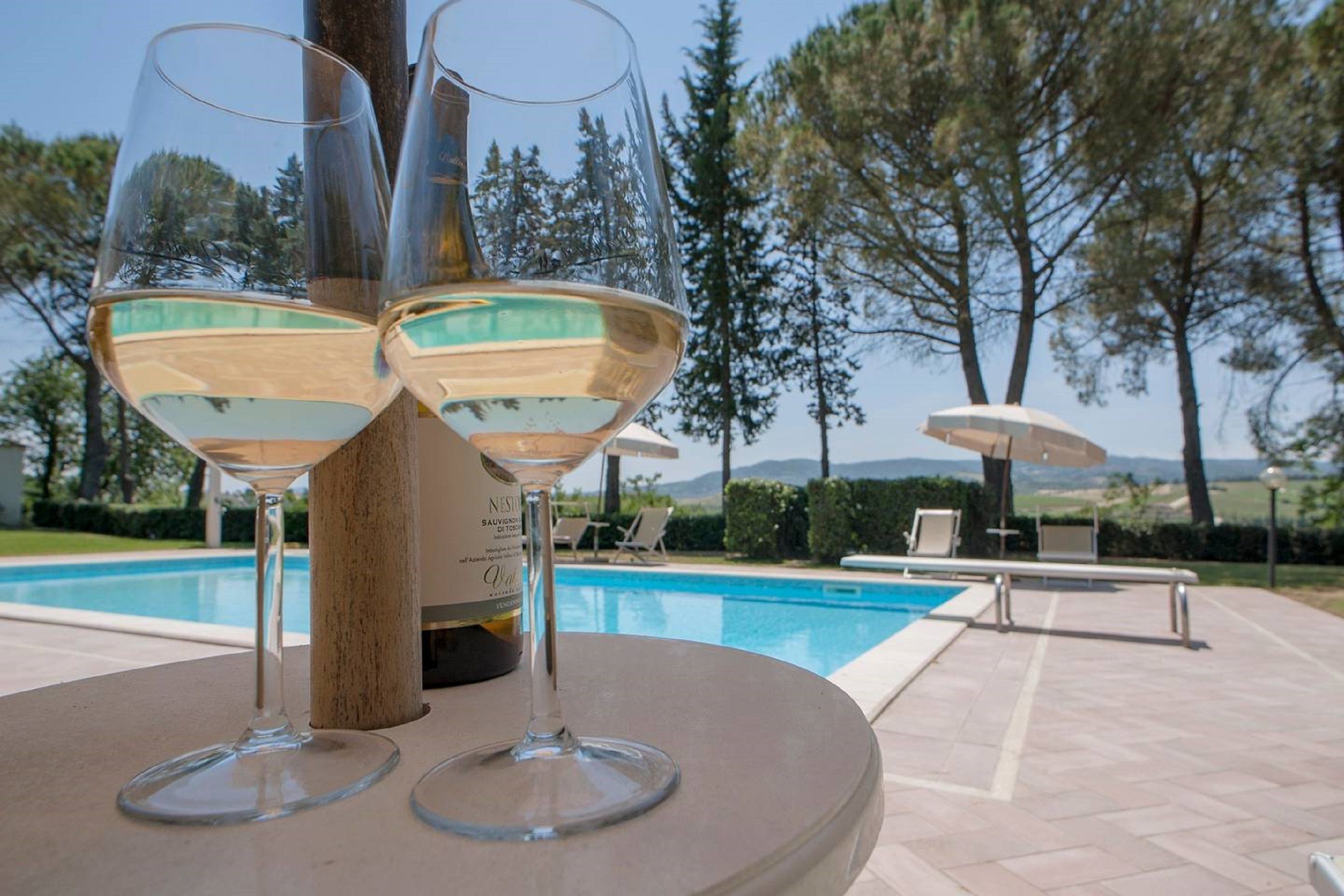 Outdoor pool, pool umbrellas, sun loungers