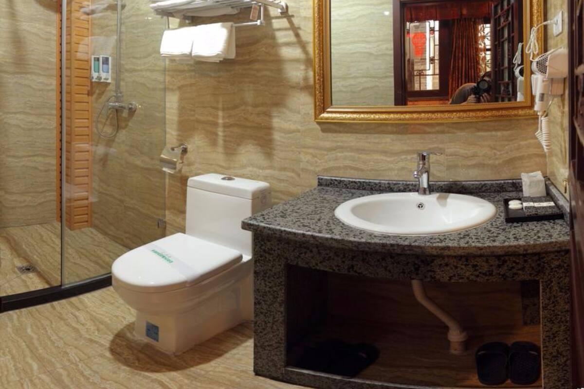 Shower, free toiletries, hair dryer, slippers