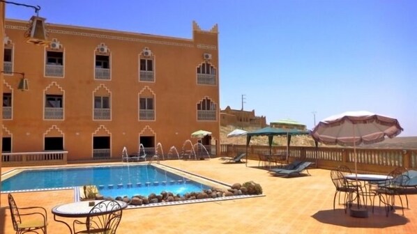 Outdoor pool, pool umbrellas, pool loungers