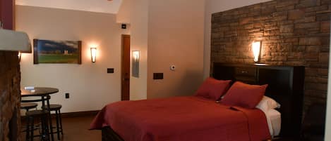 Deluxe Suite, 1 Bedroom, Accessible, Fireplace (No Jacuzzi) | Living room | Flat-screen TV, fireplace, heated floors