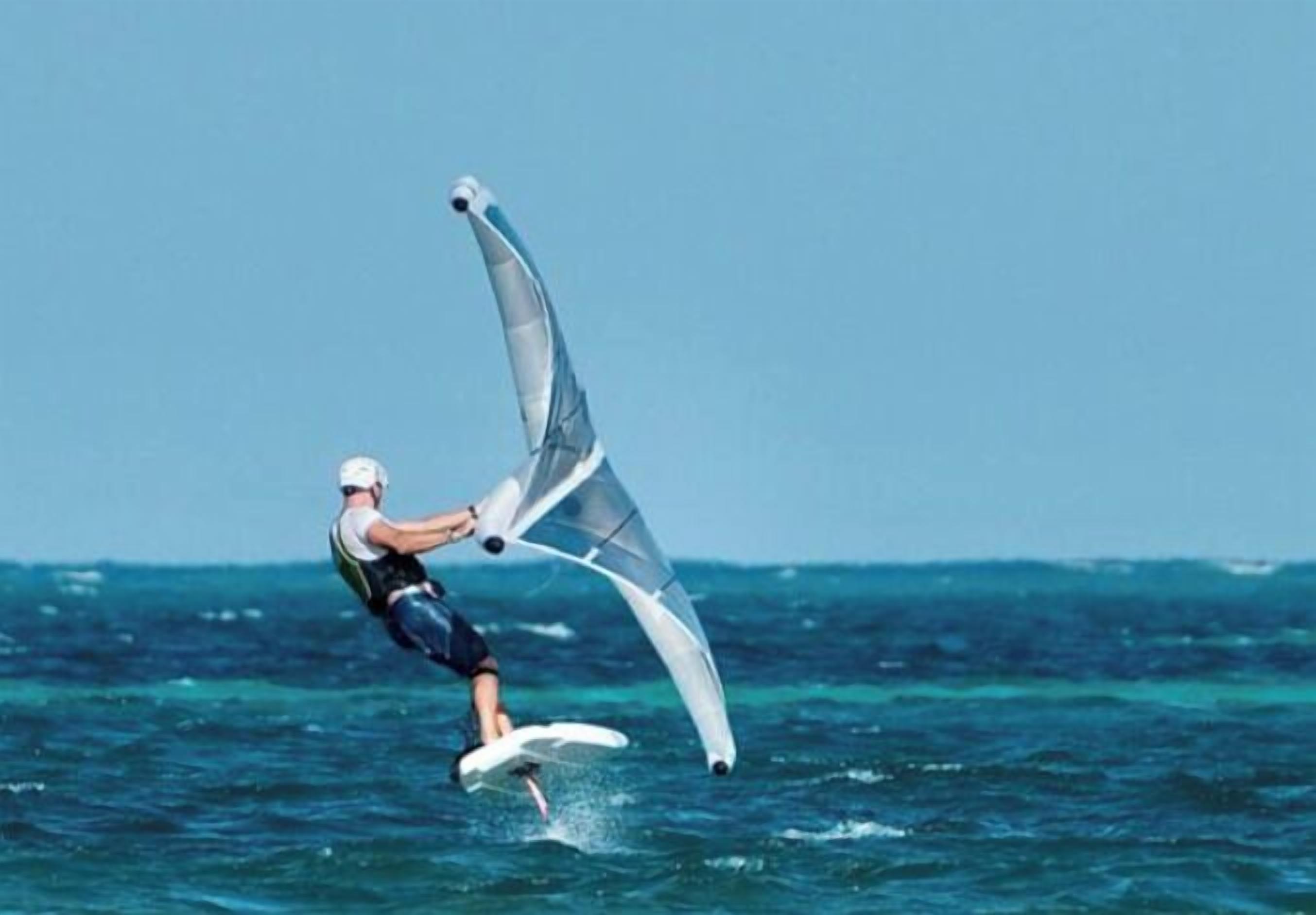 A person windsurfing on the water.