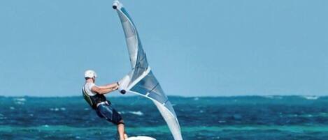 A person windsurfing on the water.