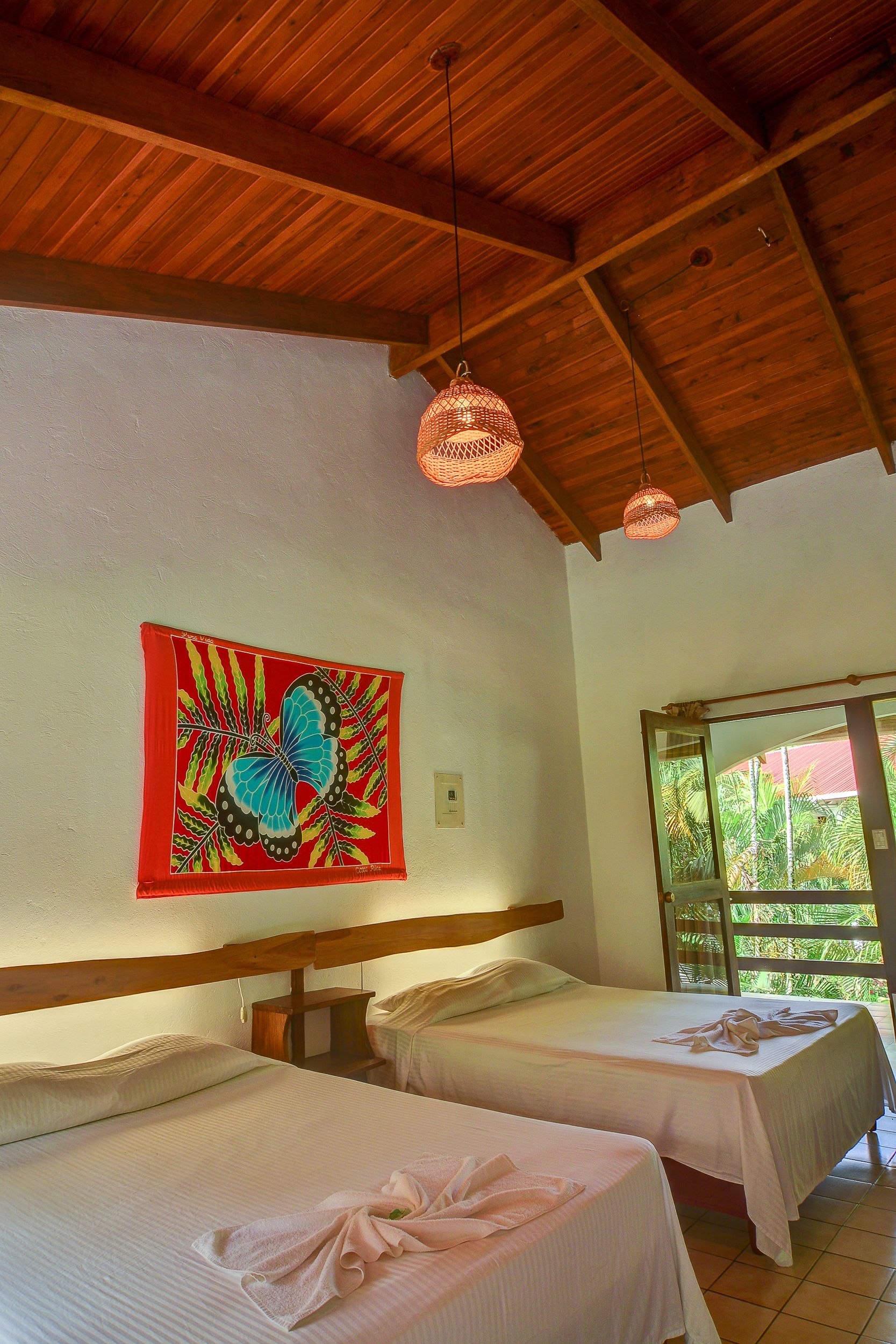 classic double or twin room, 2 queen beds, partial ocean view, beachfront | desk, free wifi