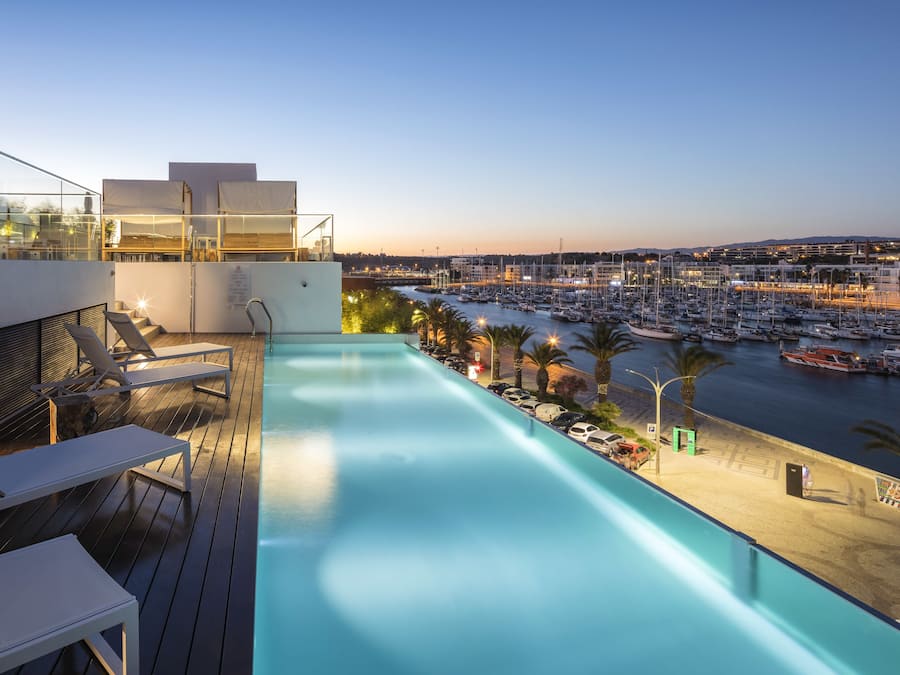 Outdoor pool, open 8 AM to 8 PM, pool umbrellas, sun loungers