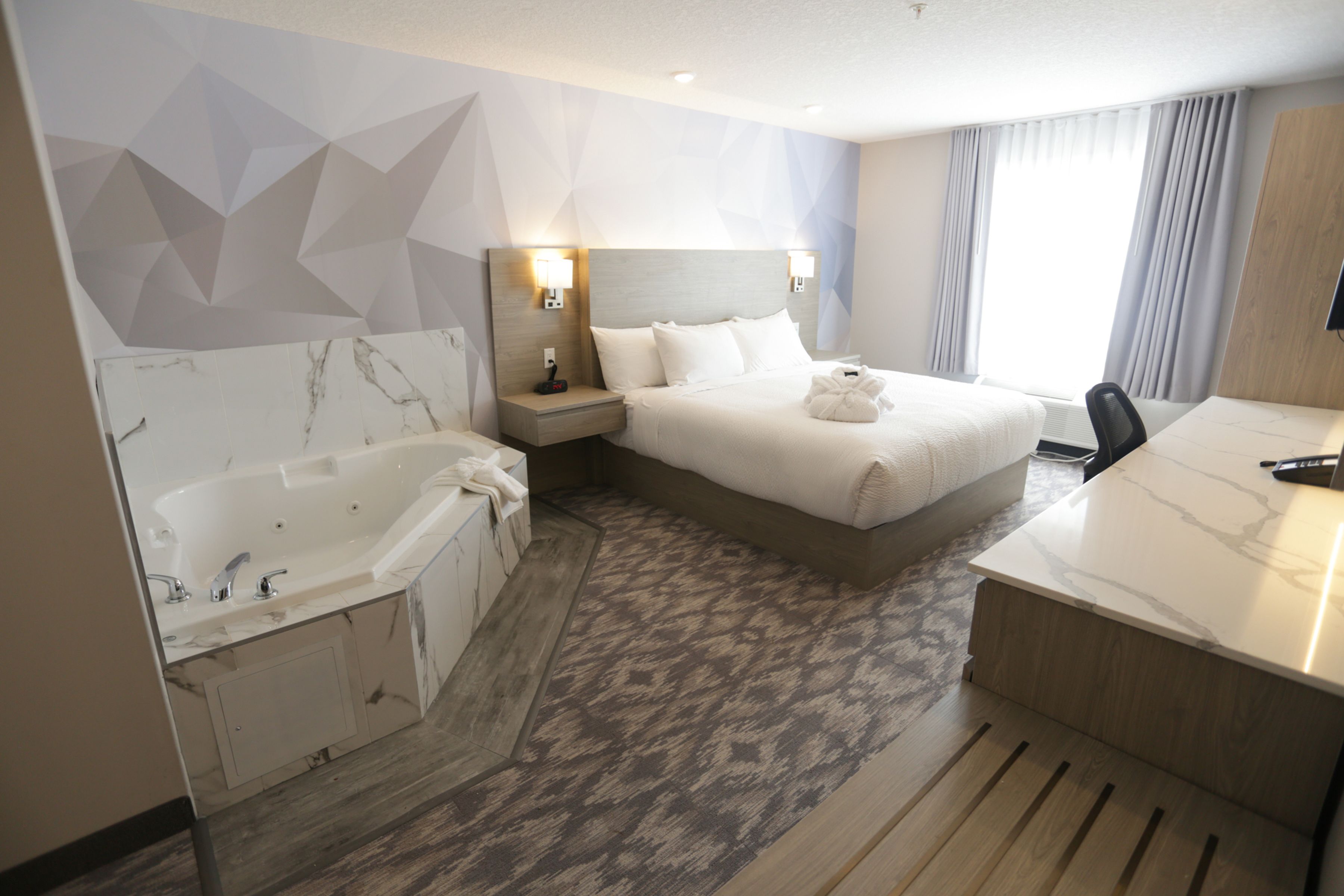 suite, 1 king bed, non smoking | desk, laptop workspace, blackout curtains, iron/ironing board