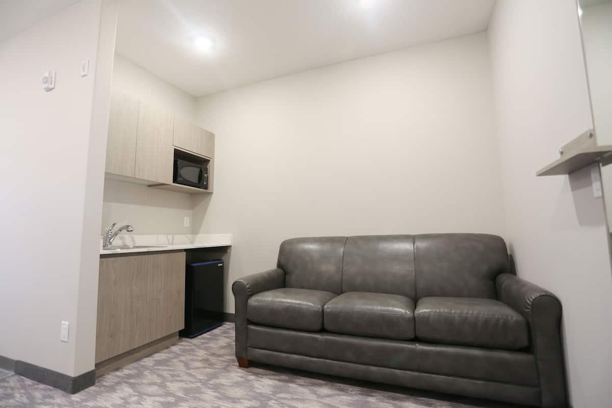 suite, 2 queen beds, non smoking | living area | flat-screen tv, pay films
