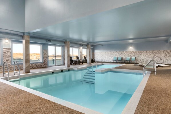 Indoor pool, open 9:00 AM to 10:00 PM, pool loungers