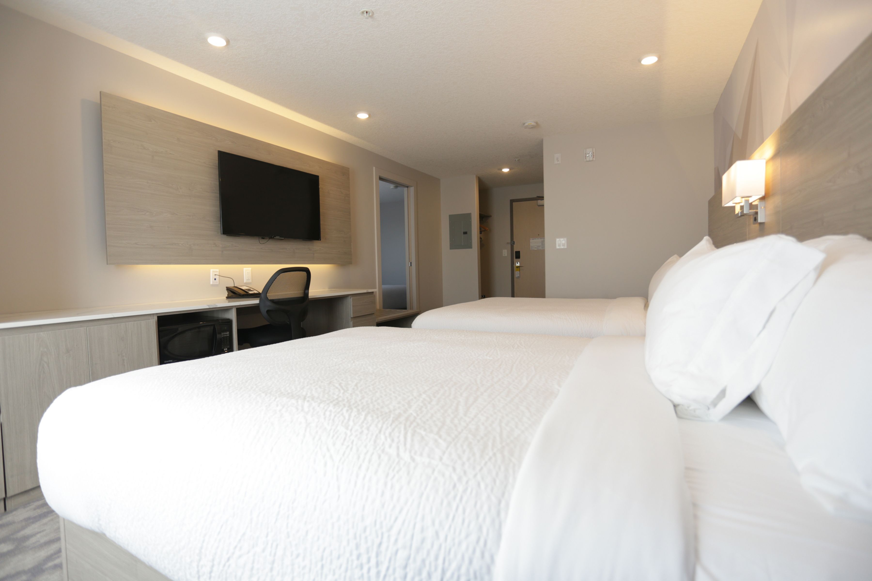 family suite, multiple beds | desk, laptop workspace, blackout curtains, iron/ironing board