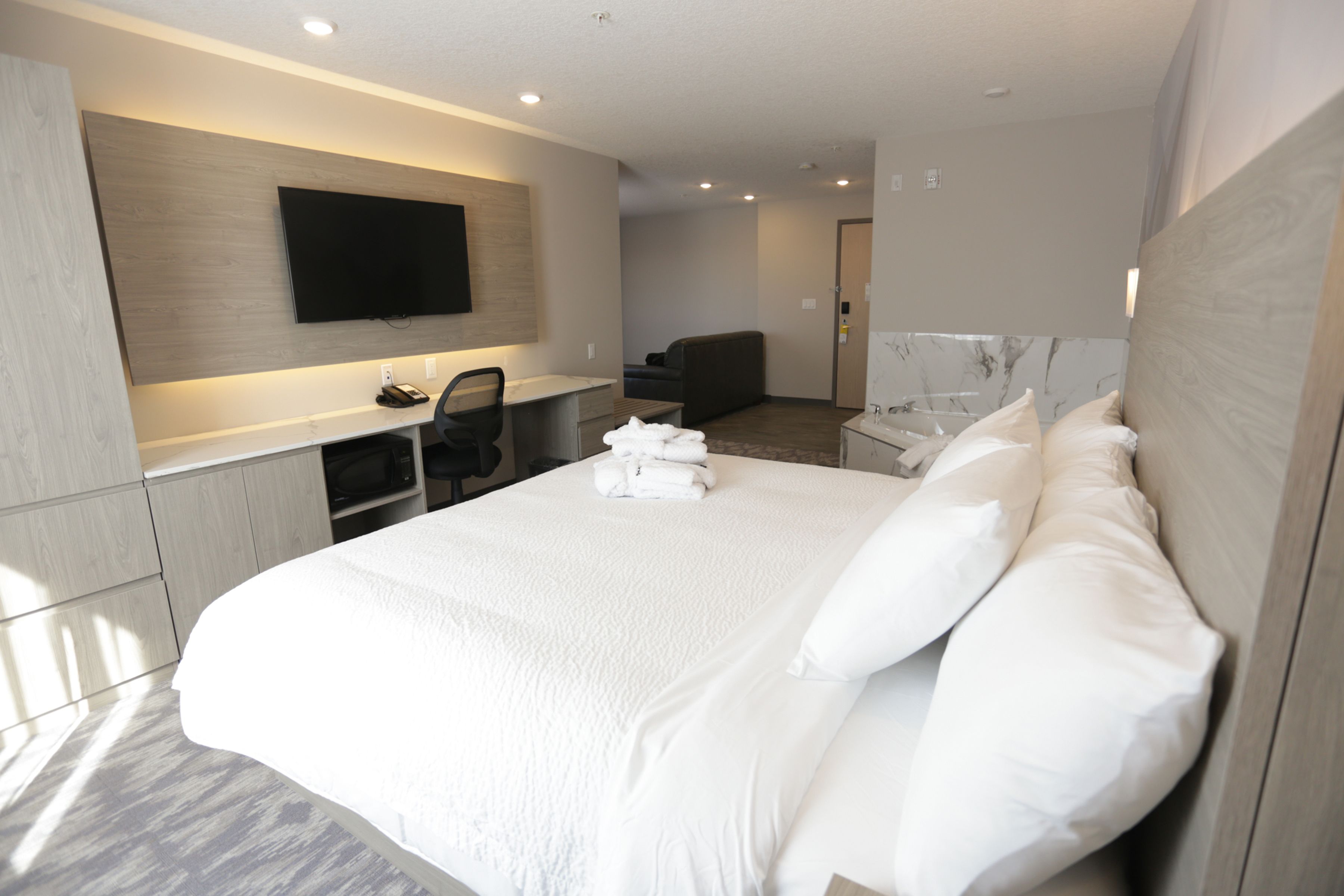 suite, 1 king bed, non smoking | desk, laptop workspace, blackout curtains, iron/ironing board