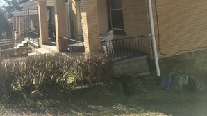 A two-story residential building with a balcony on the second floor, a front porch, and a brick facade. -  Minutes from Downtown, Pittsburgh’s international airport,  & Sports’ arenas! (Pittsburgh)
