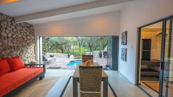 Deluxe Villa | Living area | 60-inch flat-screen TV with premium TV channels, TV