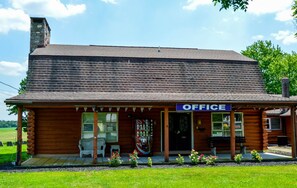 A wooden building with a sign reading "OFFICE" on the front. - Motel 6 Shartlesville, PA (Bernville)