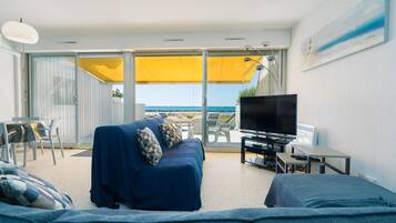 Relax in this stylish room with a sofa, flat-screen TV, and outdoor access.