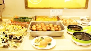 A buffet table with various food items including eggs, potatoes, and salads. - GreenTree Inn Qingdao Development District SDUST Express Hotel (Qingdao)