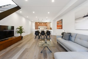 3 Bedroom House | Living area | 50-inch flat-screen TV with cable channels, LED TV, DVD player - Boutique Stays - County Down, Port Melbourne (Port Melbourne)