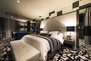 Premium bedding, down comforters, minibar, in-room safe