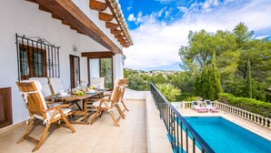 A terrace with a pool, dining area, and outdoor seating. - Perfect private holiday hideaway (Teulada)