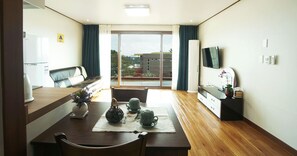 Condo (22py (Block A, 1F)) | Living area | LCD TV, heated floors - Oasis Pension (Seogwipo)