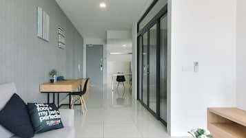 Deluxe Suite, 1 Queen Bed, City View | Living room | Flat-screen TV