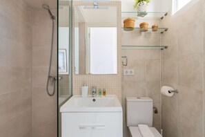 Shower, hair dryer, towels, toilet paper