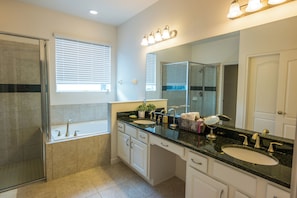 Combined shower/tub, hair dryer, towels, soap