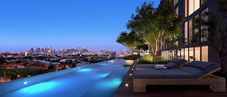 Outdoor pool, open 8:00 AM to 10:00 PM, sun loungers