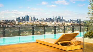 Outdoor pool, open 8:00 AM to 10:00 PM, sun loungers