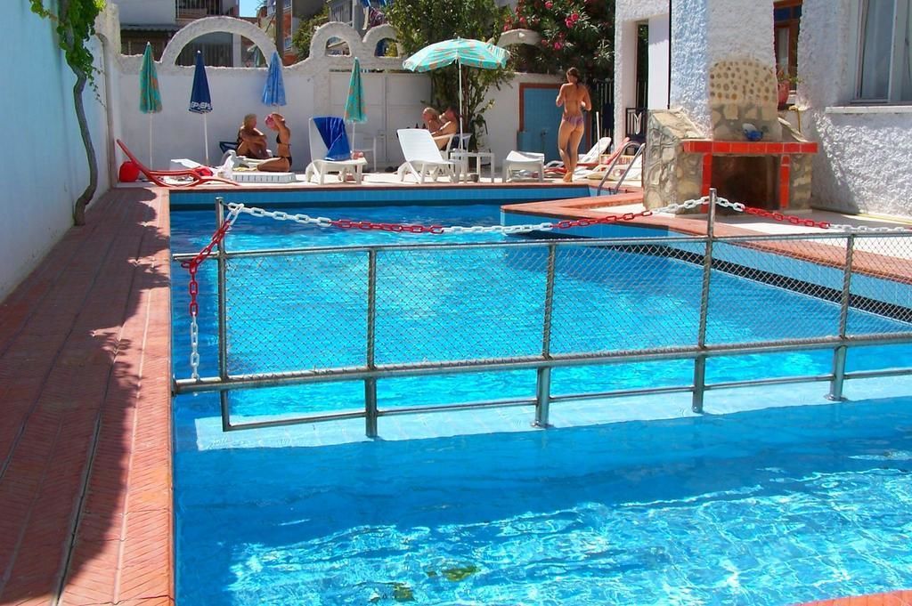 Seasonal outdoor pool, pool umbrellas, pool loungers