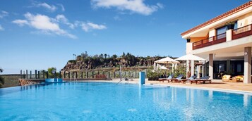 Outdoor pool, pool umbrellas, pool loungers