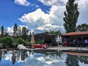 Outdoor pool, pool umbrellas, sun loungers