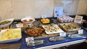 A buffet with various dishes including fresh salad, fried chicken, and dumplings. - Toyoko Inn Osaka Hommachi No.2 (Osaka)