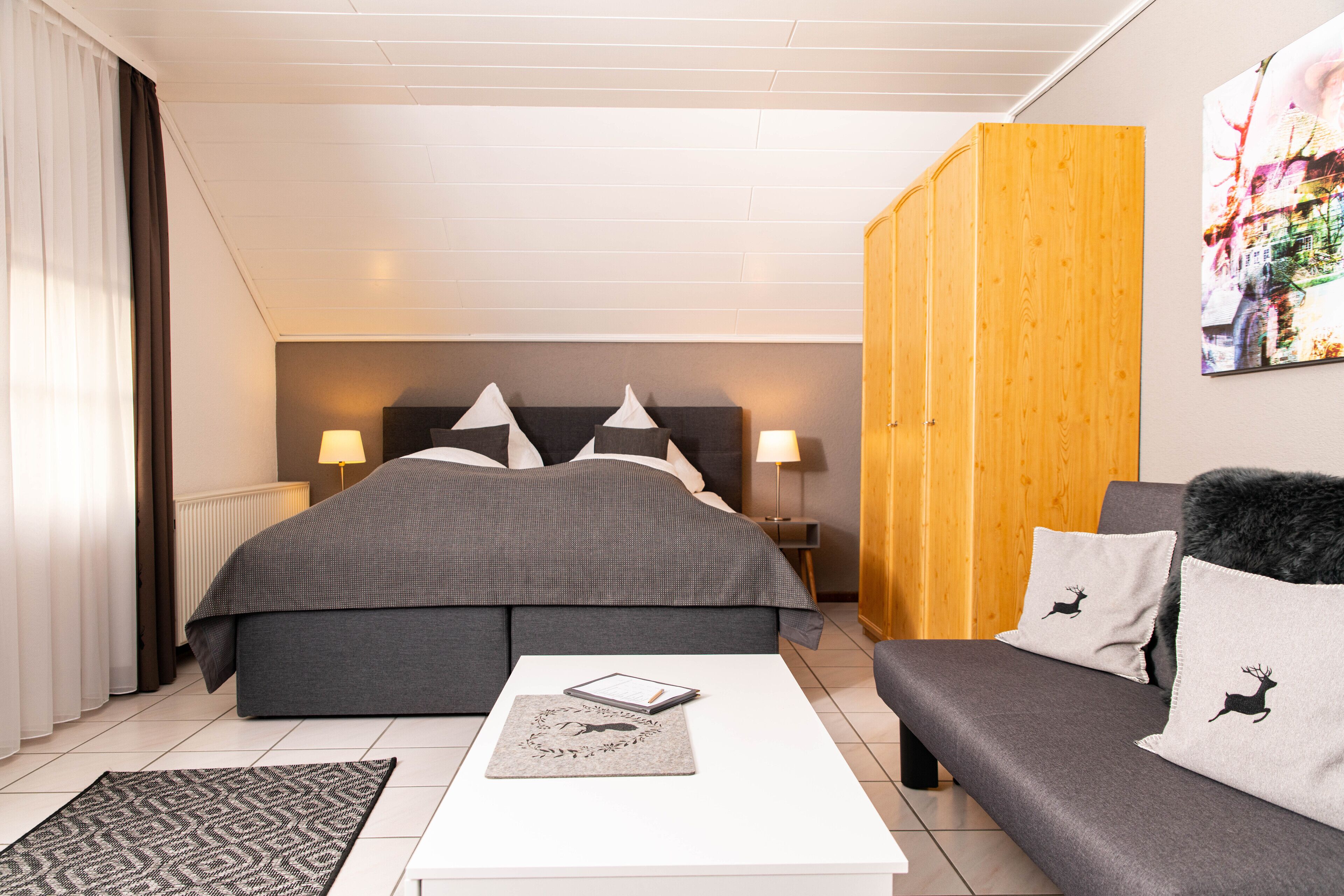 suite | premium bedding, desk, laptop workspace, blackout curtains