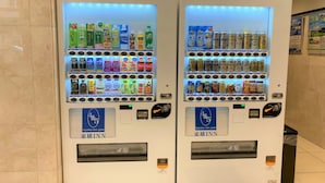 Two vending machines with a variety of beverages and snacks, including Coca-Cola and Sprite, and a 4&5 logo on the front. - Toyoko Inn Kintetsu Yokkaichi-eki Kita-guchi (Yokkaichi)