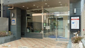 A building entrance with a glass door, a tiled floor, and a signboard. - Toyoko Inn Kintetsu Yokkaichi-eki Kita-guchi (Yokkaichi)