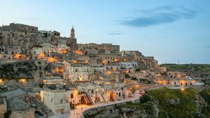 A historic town with stone buildings, a prominent church, and a winding road.