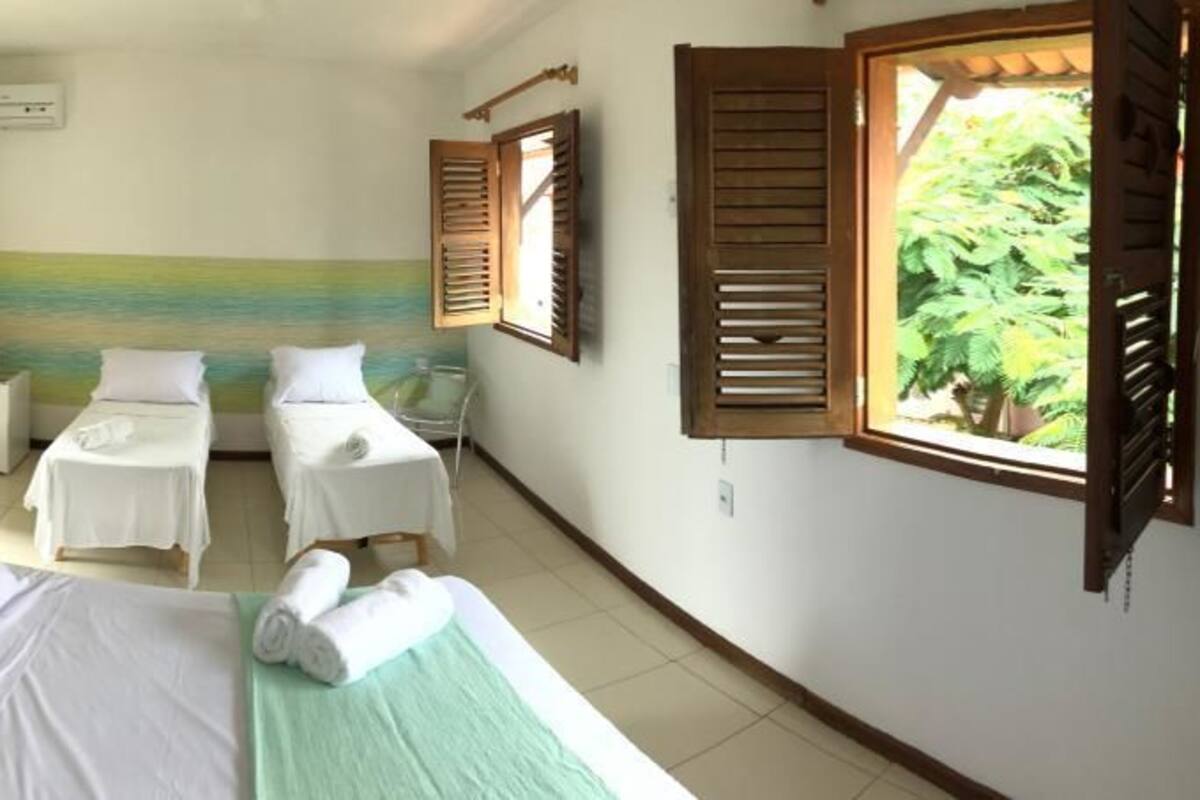 Habitación cuádruple | Minibar, wifi gratis, ropa de cama