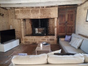 Deluxe House, 4 Bedrooms, Private Pool, Garden View | Living area | 48-inch flat-screen TV with digital channels, fireplace, DVD player - Clos Lamonzie (Sarlat-la-Canéda)