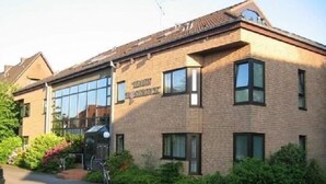 A two-story building with a sign reading "Hotel Rosenthal." - Haus Roseneck (Bad Bevensen)