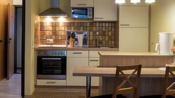 Comfort Apartment, 1 King Bed | Private kitchen | Full-sized fridge, microwave, oven, stovetop