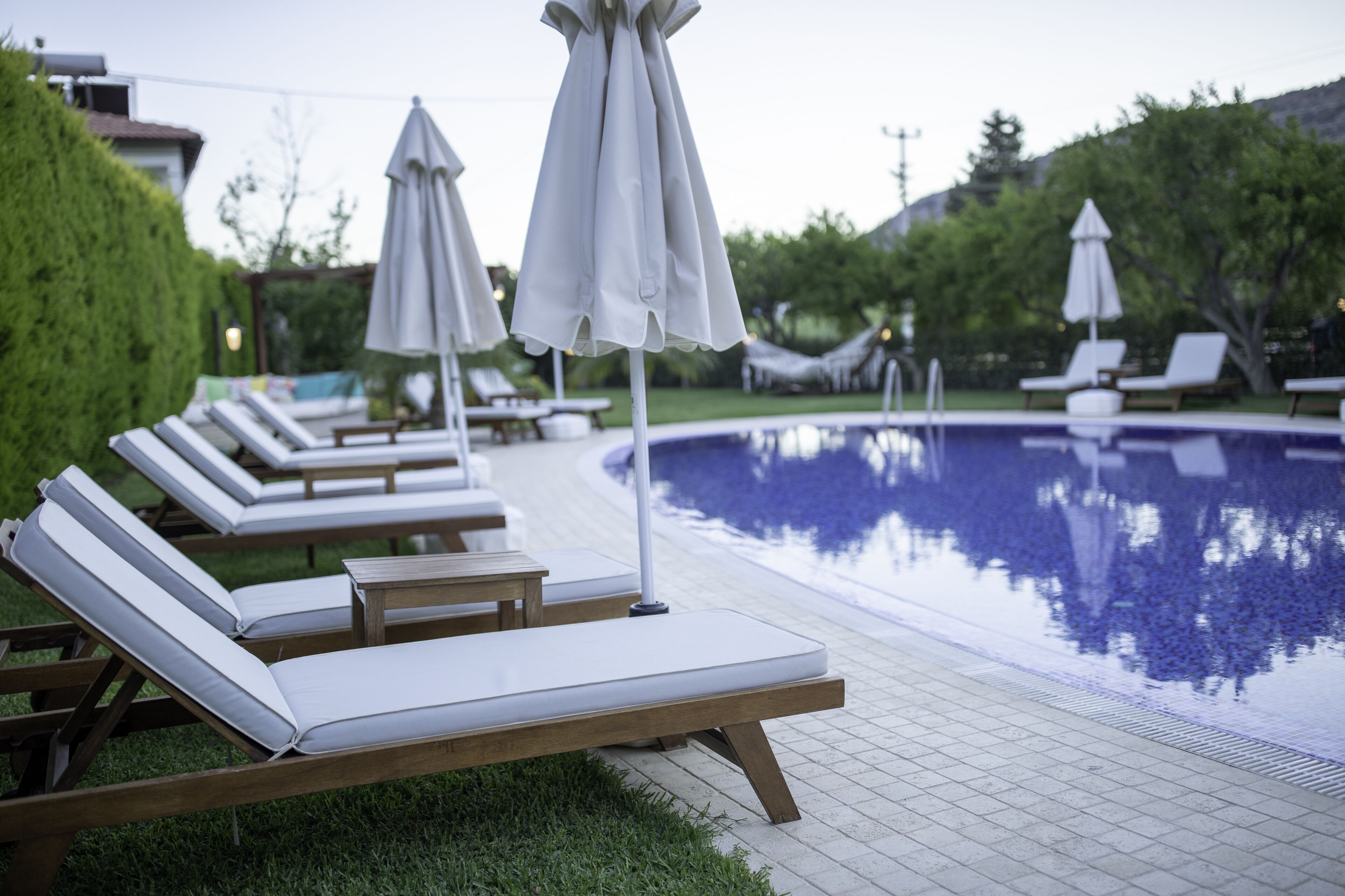 outdoor pool, pool umbrellas, pool loungers