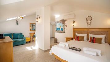 Deluxe Quadruple Room | Premium bedding, minibar, in-room safe, blackout curtains