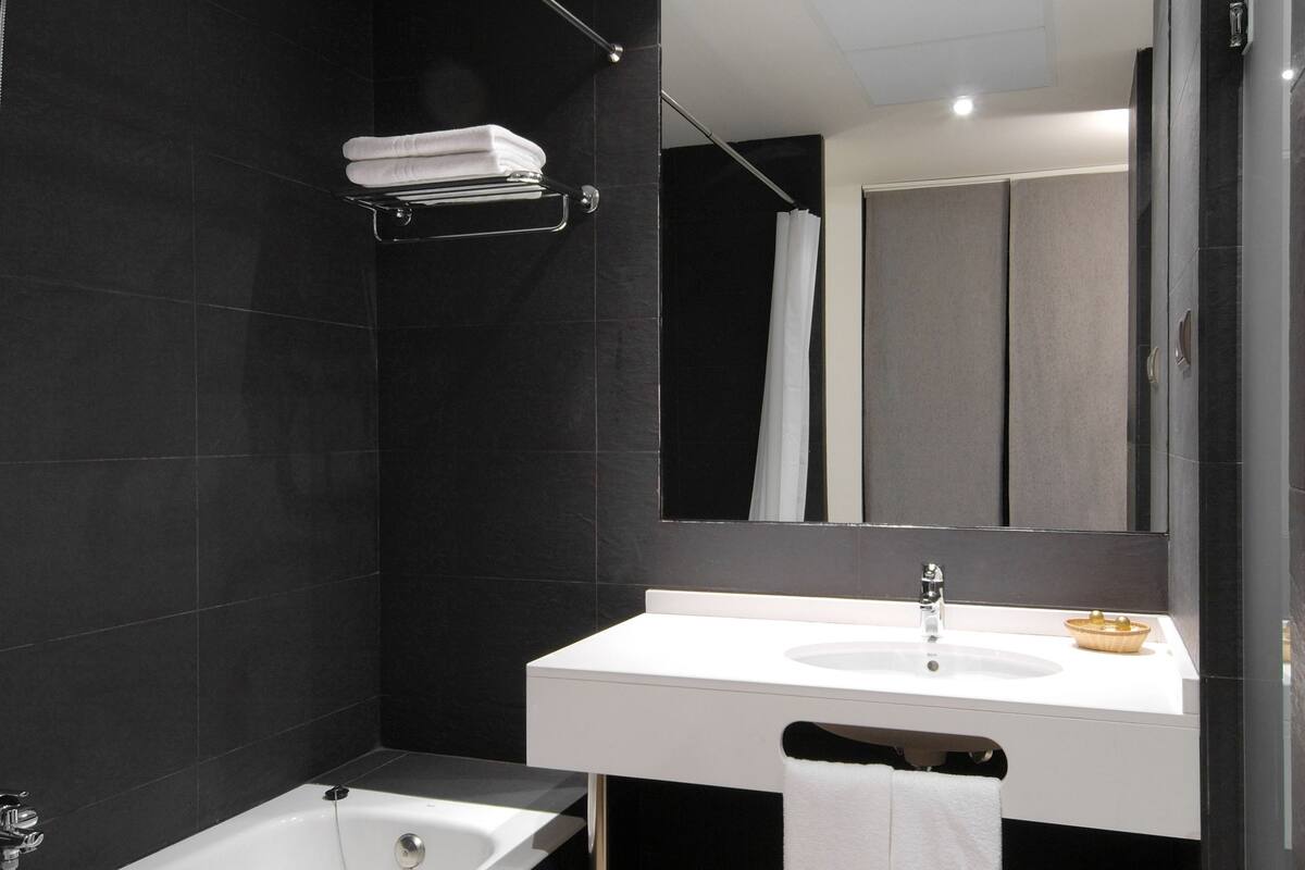 superior double room | bathroom | bathtub, free toiletries, hair dryer, bidet