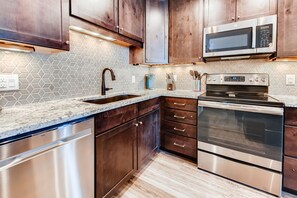 Mountainside, 2 Bedroom - D257 | Private kitchen | Fridge, microwave, oven, stovetop - Mountainside Condominiums by CRMR (Frisco)