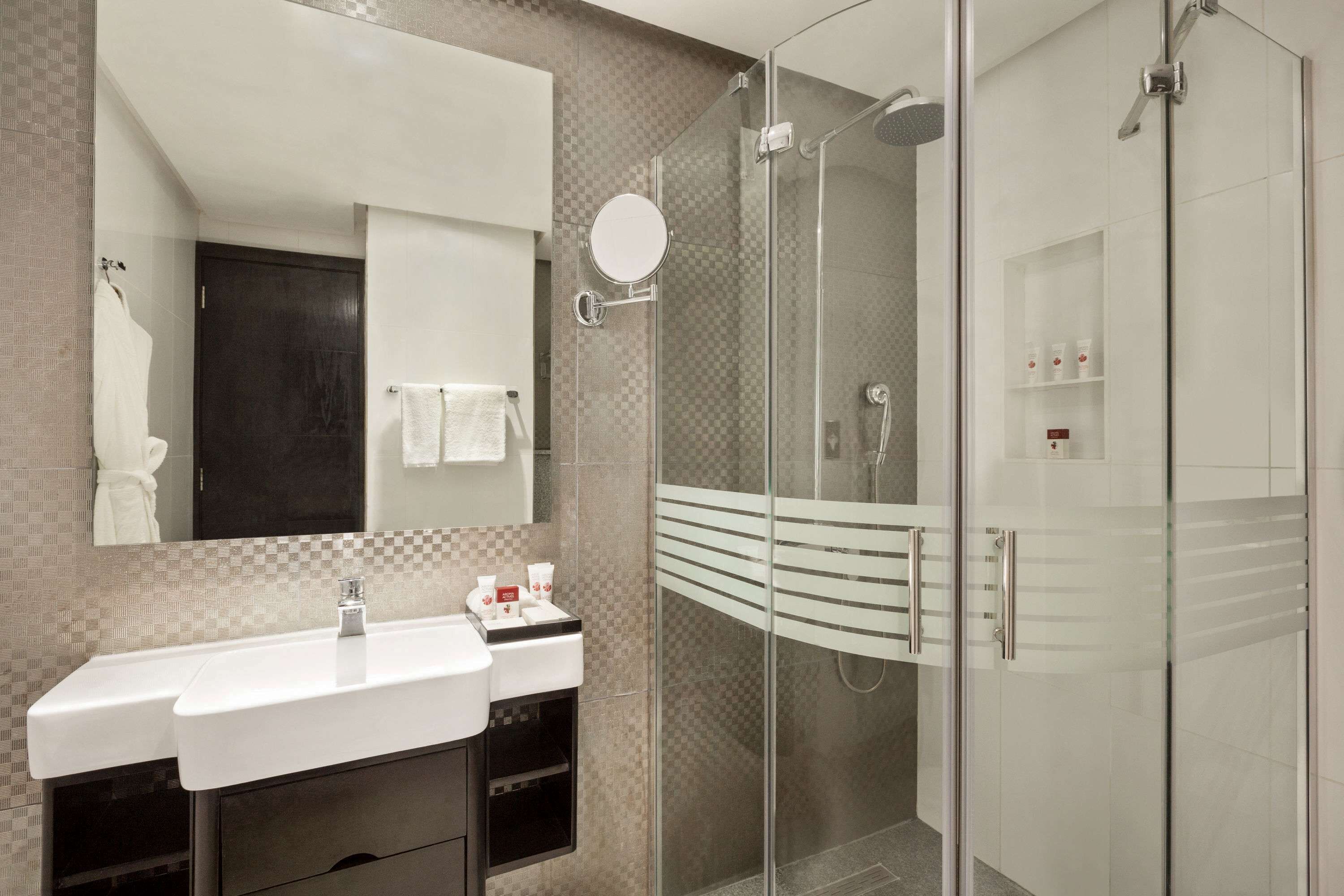 deep-soaking bathtub, rainfall showerhead, designer toiletries